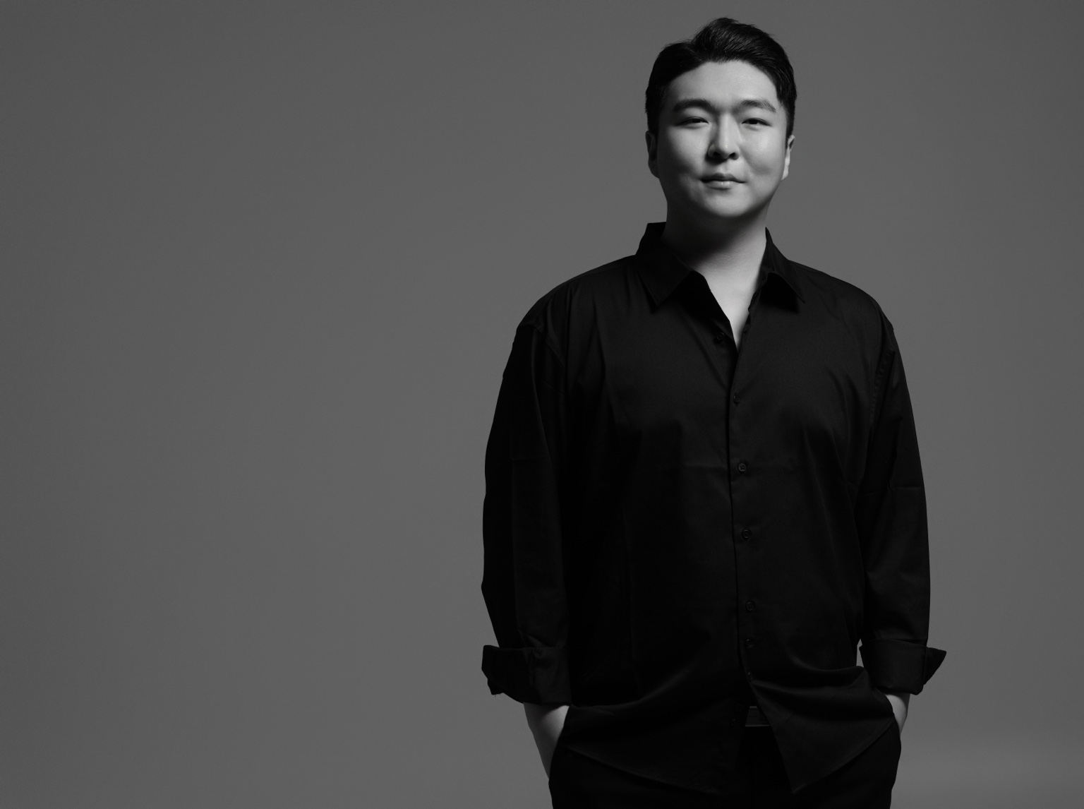 Stephano Park — black-and-white portrait facing the camera in a black shirt